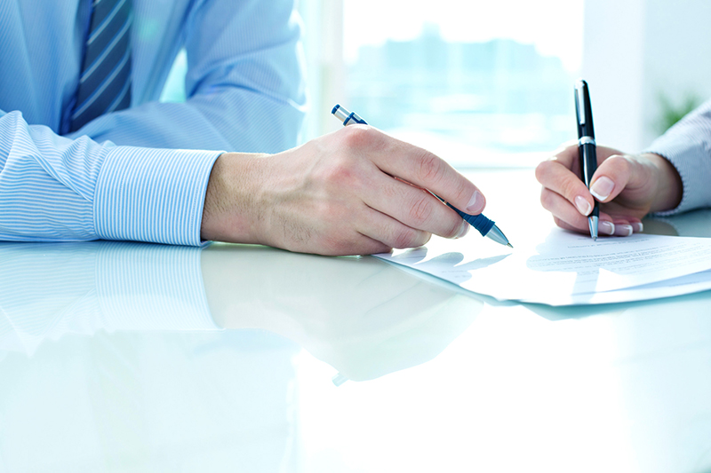 Two people reviewing document